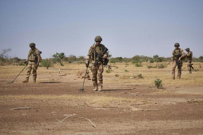 French soldiers use detectors while searching for IEDs (Improvised Explosive Devices), which kill scores each year in the jihadist-hit Sahel region
