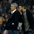 Quique Setien listens to Barca assistant coach Eder Sarabia