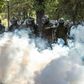 Demonstrators clash with Chilean riot police during a protest against Chilean President Sebastian Pinera's government in Santiago, on March 13, 2020.