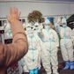 Medical staff members wave to a recovered patient at a makeshift hospital for the COVID-19 coronavirus patients in Wuhan