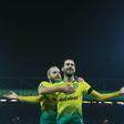Staying alive: Mario Vrancic (right) scored the opening goal as bottom-of-the-table Norwich held Tottenham