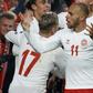 Danish delight: Martin Braithwaite (centre) celebrates the goal which secured Denmark qualification for Euro 2020