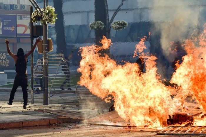 Protestors set fires outside the Vina del Mar music festival in Chile on February 23, 2020