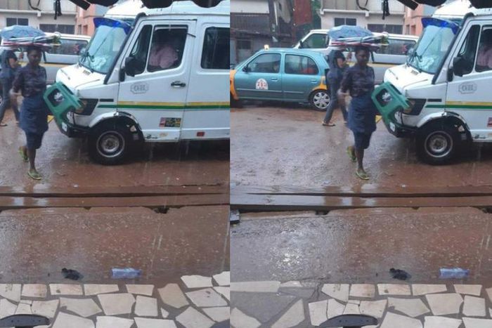 Umbrella seller refuses to use one of her umbrellas to protect herself against rain