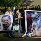 Supporters of Peruvian ex-president Alberto Fujimori (pictured October 2018) hold up posters of the former leader, who has been hospitalized for neurological and pulmonary issues
