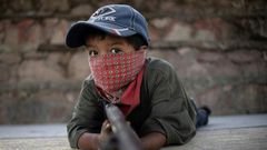 Children in Ayahualtempa train with rifles or makeshift guns to join the fight against drug cartels