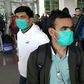 Pakistani students wearing protective face masks arriving in Islamabad from China