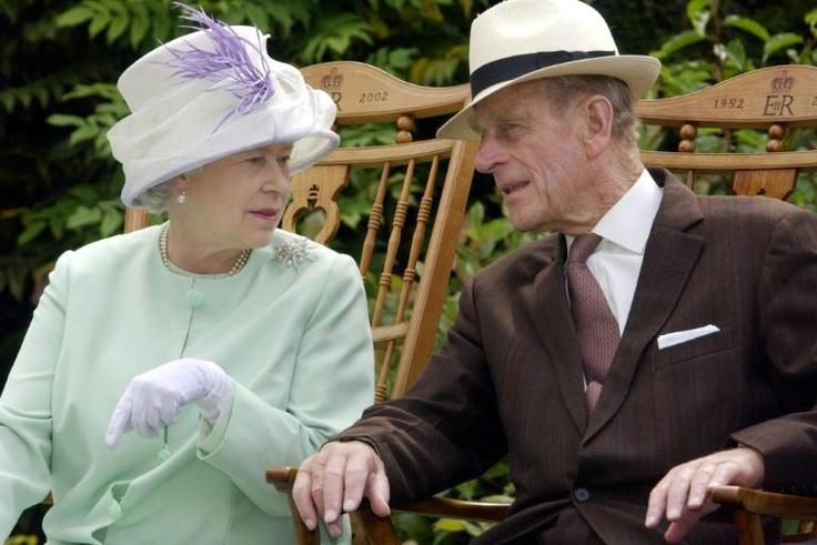 Britain's Queen Elizabeth II and Prince Philip, who is undergoing hospital treatment for what Buckingham Palace described as a "pre-existing condition"