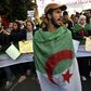 Algerian students and other protesters take part in an anti-government demonstration in the capital Algiers, on February 18