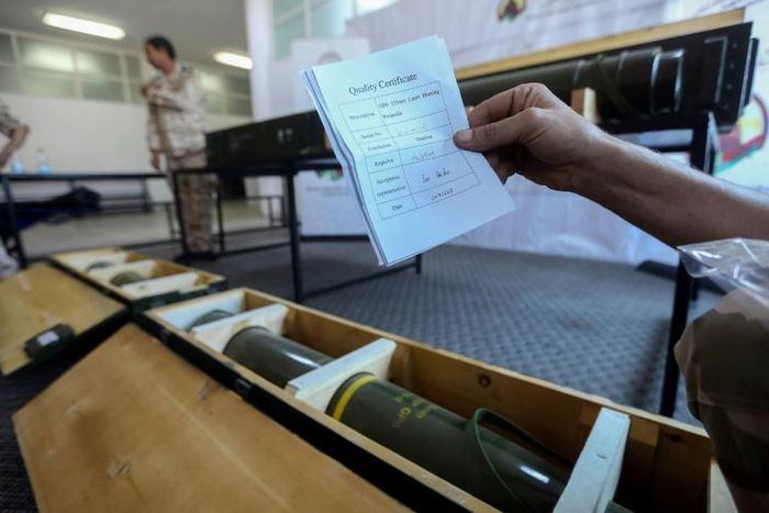 Fighters loyal to Libya's UN-recognised government display Chinese-made shells bearing the markings of the United Arab Emirates, reportedly seized from Haftar's forces, in June 2019