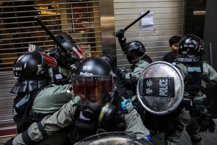 The city witnessed one of the most violent days yet in five months of unrest on Monday, with a police officer shooting a masked student and a pro-Beijing man set on fire