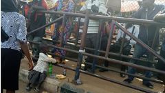 Little girl stranded at BRT station, sits ignorantly beside her mother’s dead body (photos)