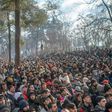Some of the thousands of migrants gathered at the Turkish side of the border