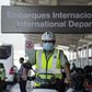 A policeman wears a face mask to prevent the spread of the new Coronavirus at the Santiago international airport
