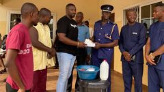 John Dumelo donates items to Ayawaso West police officer to fight coronavirus