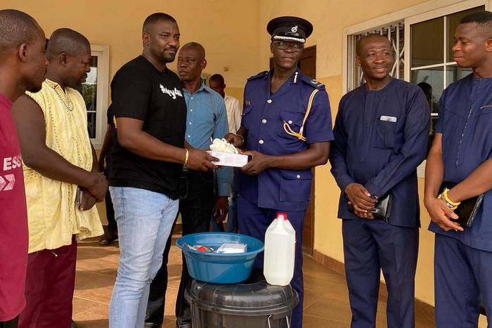 John Dumelo donates items to Ayawaso West police officer to fight coronavirus