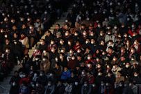 Football fans in South Korea watch games with masks