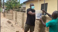Dumelo assisting community water project