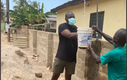 Dumelo assisting community water project