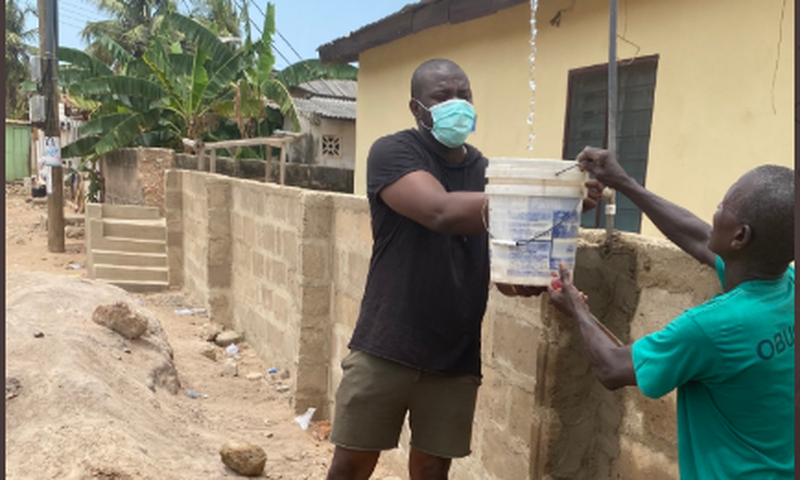 Dumelo assisting community water project