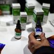 A man examines medicine containing cannabis at the start of the Expo Cannabis in Buenos Aires, Argentina, in October 2019.