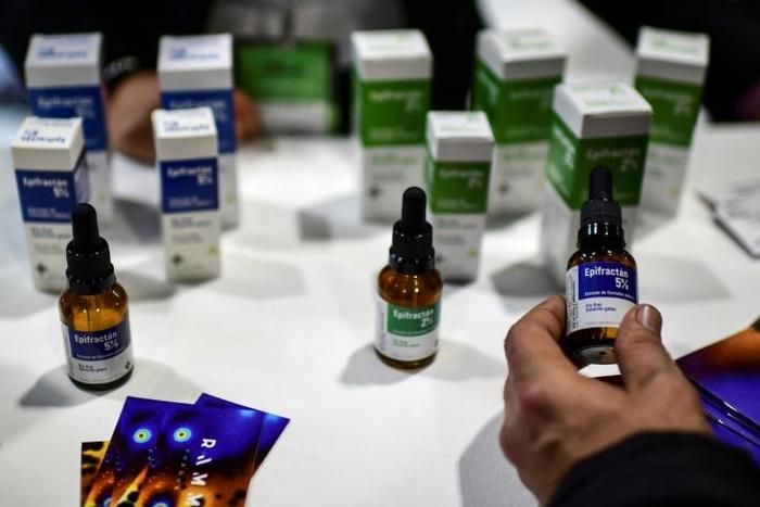 A man examines medicine containing cannabis at the start of the Expo Cannabis in Buenos Aires, Argentina, in October 2019.