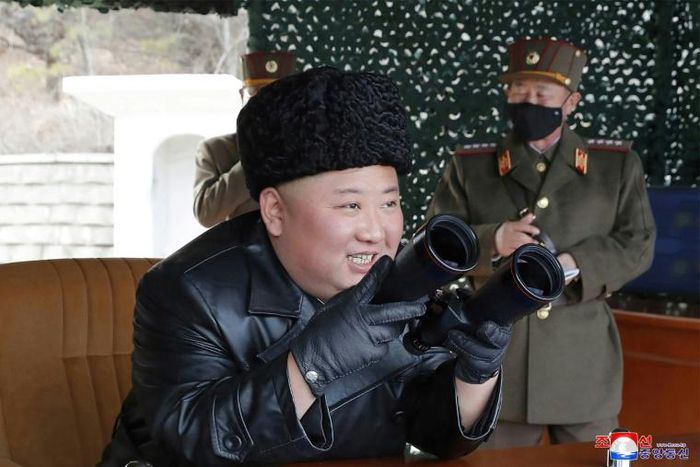 North Korean leader Kim Jong Un did not don a facemask to supervise the firing of what state media called a 'long-range artillery' drill