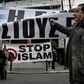 An anti-migrant rally in Athens where a journalist was attacked