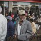 An elderly man from Soweto queues to collect his social grant