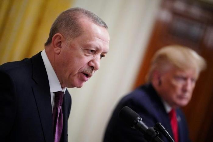 US President Donald Trump and Turkey's President Recep Tayyip Erdogan (L) in Washington, DC on November 13, 2019; Erdogan has sought to defuse the issue with plans to create a "safe zone" in northern Syria to which refugees can return, though rights gr...