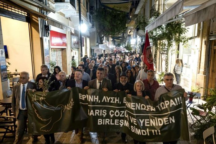 Cypriot demonstrators from both sides of the divided island marched in Nicosia to call for progress in reunifications talks