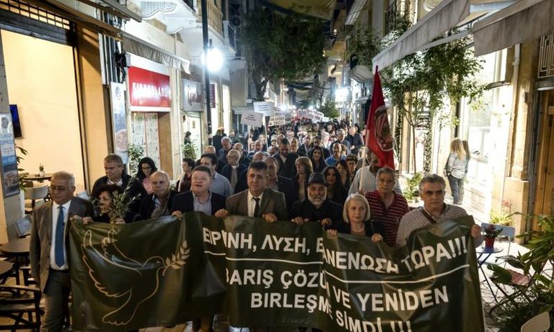Cypriot demonstrators from both sides of the divided island marched in Nicosia to call for progress in reunifications talks