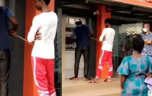 Man uses stick to withdraw money from ATM to avoid contracting COVID-19 (video)