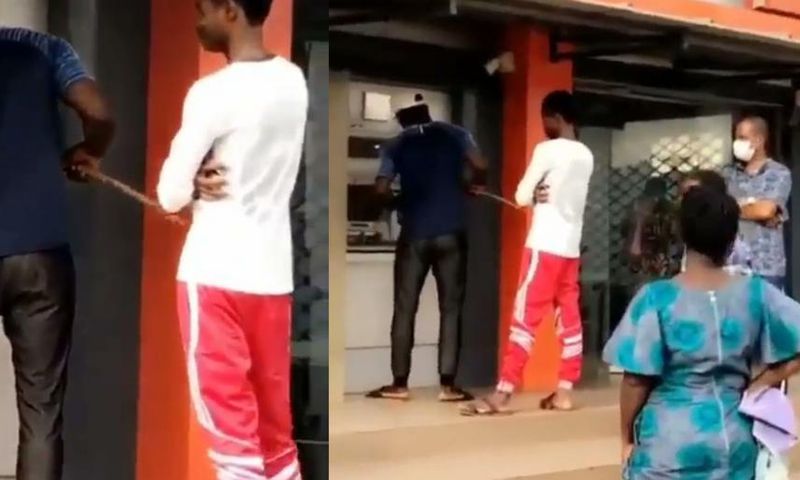 Man uses stick to withdraw money from ATM to avoid contracting COVID-19 (video)