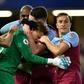 West Ham goalkeeper David Martin celebrates with team-mates after their win at Chelsea
