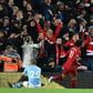 Mohamed Salah (C) celebrates scoring for leaders Liverpool in a Premier League victory over Manchester City last Sunday