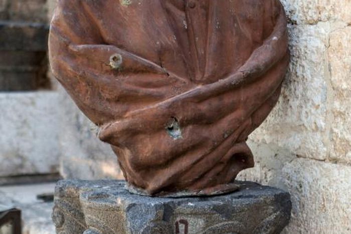 A picture taken on June 13, 2013 shows a beheaded statue of Abu al-Alaa al-Maari, a famous blind Arab philisopher and poet, displayed at the Maaret al-Numan museum