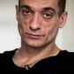 Russian artist Pyotr Pavlensky poses during a press interview with AFP at his lawyer's office in Paris on February 14, 2020.Pavlensky was placed in custody on February 15, 2020 as part of an investigation for violence on December 31, 2019.
Emmanuel Mac...