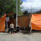 Opponents of Bolivian ex-president Evo Morales camp at the entrance of the La Rinconada gated community in La Paz, where the Mexican embassy is located and where some members of Morales' government have taken refuge