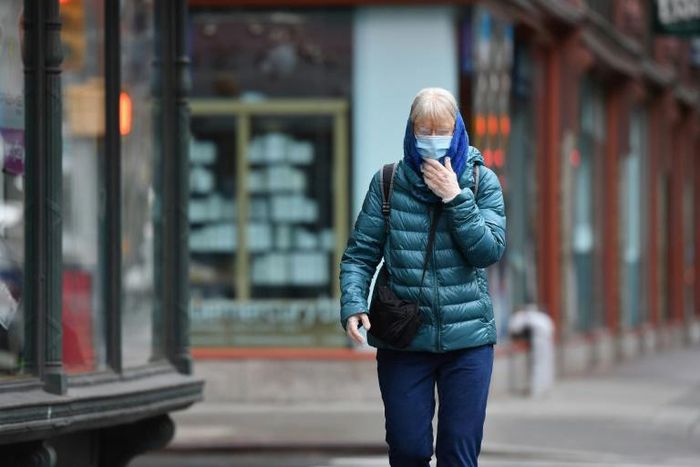 A New Yorker wears a face mask on the street