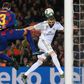 Barcelona defender Gerard Pique (left) challenges Real Madrid's Karim Benzema (right) during the Clasico on Wednesday.