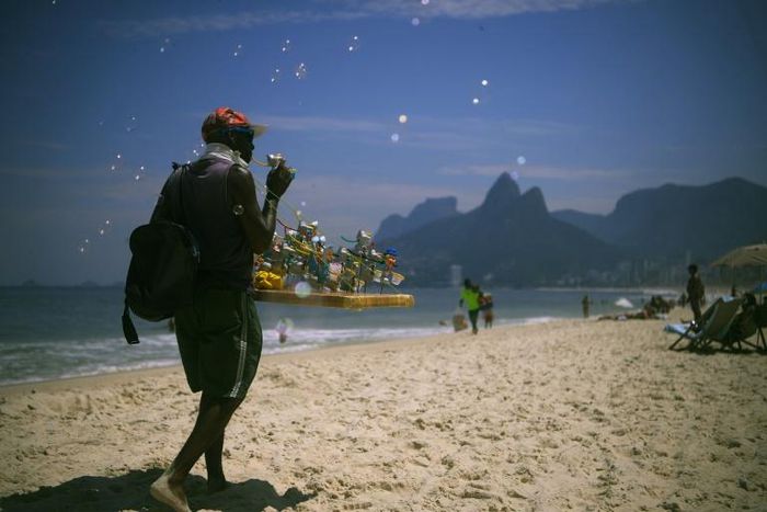 Brazilian beach vendor Marco Conceicao offers bubble toys for sale on Rio de Janeiro's Ipanema on March 19, 2020