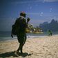 Brazilian beach vendor Marco Conceicao offers bubble toys for sale on Rio de Janeiro's Ipanema on March 19, 2020
