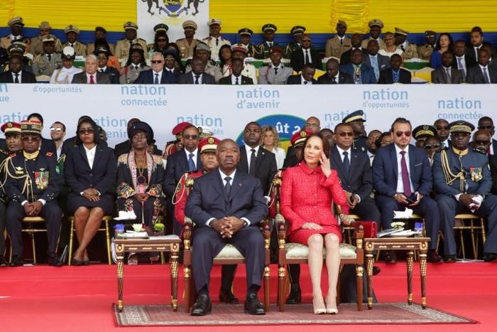 File picture from Gabon's independence day celebrations on August 17, with President Ali Bongo and his wife Sylvia sitting on the tribune and Bongo's chief of staff, Brice Laccruche Alihanga, seated behind them, second from right