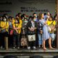 Foreign tourists take pictures next to Thai commuters with face masks as they wait for a canal boat in BangkokA Thai man has died from complications doctors say were due to the deadly coronavirus, though health officials were reluctant on March 2 to co...