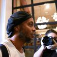 Brazilian former soccer star Ronaldinho arrives at a hotel in downtown Asuncion on April 7 to begin his house arrest after his release from jail