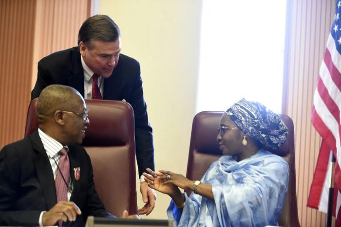 Stuart Symington, who has been appointed as the US special envoy on South Sudan, stands behind two Nigerian ministers in 2017 when he was ambassador to Abuja