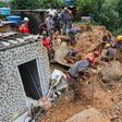 Rescuers search for victims at the Morro do Macaco Molhado favela in the coastal city of Guaruja, Sao Paulo, after it was struck by torrential rains