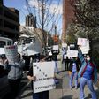 Members of the medical staff listen as Montefiore Medical Center nurses call for N95 masks and other ‘critical’ PPE to handle the coronavirus (COVID-19) pandemic on April 1, 2020 in New York