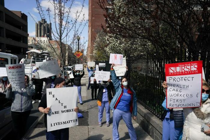 Members of the medical staff listen as Montefiore Medical Center nurses call for N95 masks and other ‘critical’ PPE to handle the coronavirus (COVID-19) pandemic on April 1, 2020 in New York